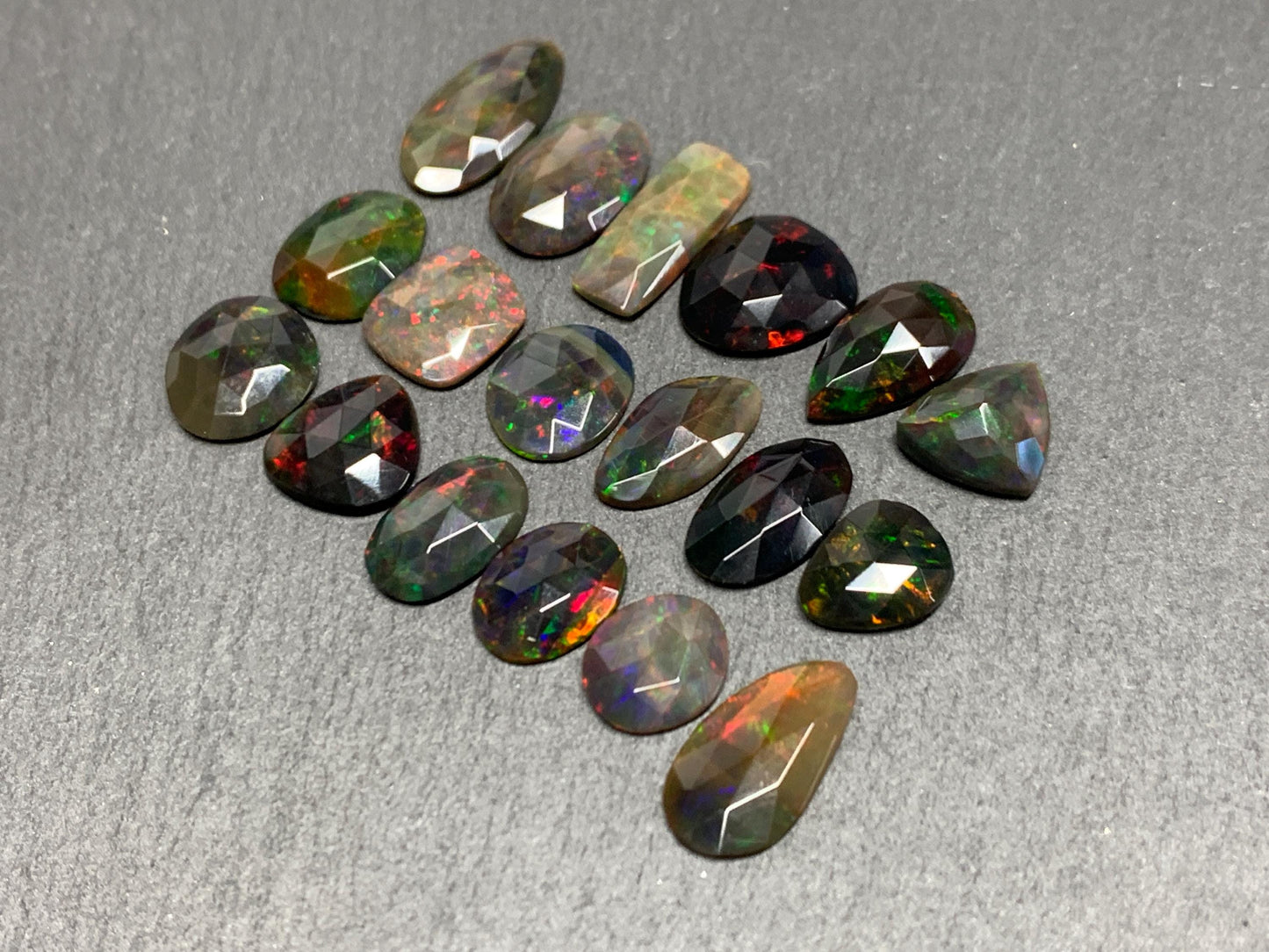 Faceted Black Opal oval 10-16mm long cabochon