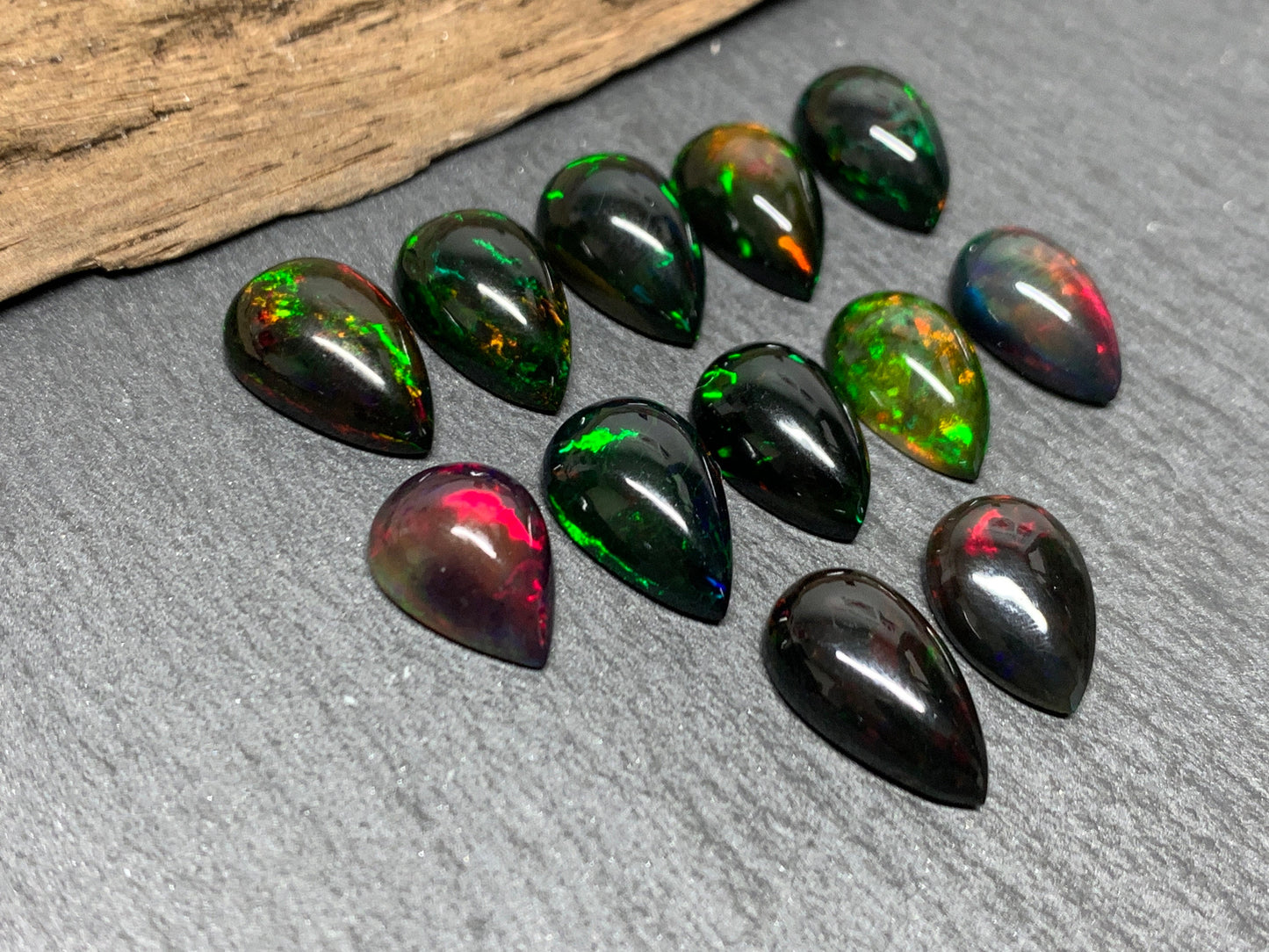 Black Ethiopian Opal pear 12-13mm long cabochon