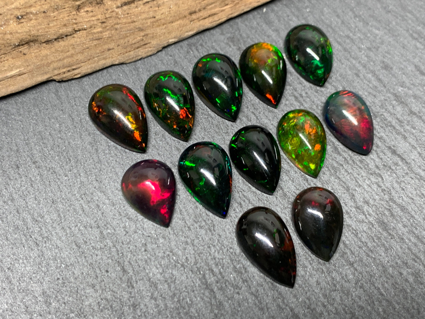 Black Ethiopian Opal pear 12-13mm long cabochon