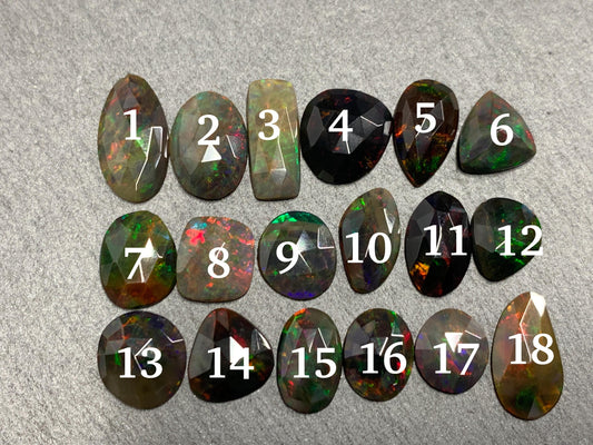 Faceted Black Opal oval 10-16mm long cabochon