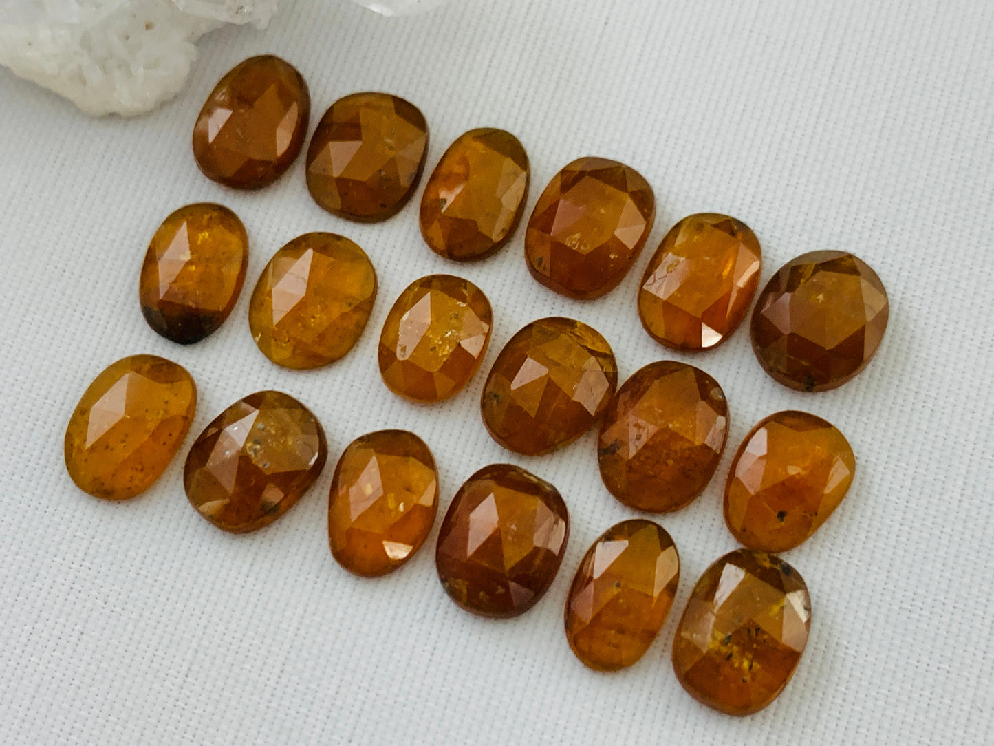 Faceted Orange Kyanite oval 9-10mm long cabochon