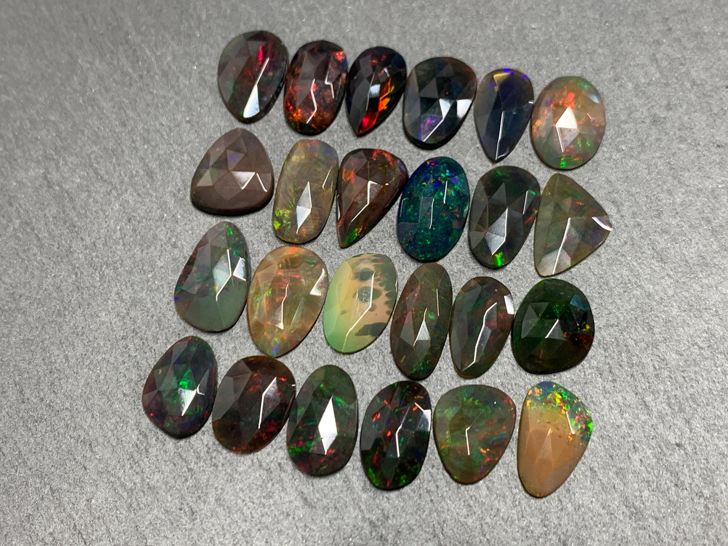 Faceted Black Opal 11-14mm long free form cabochon