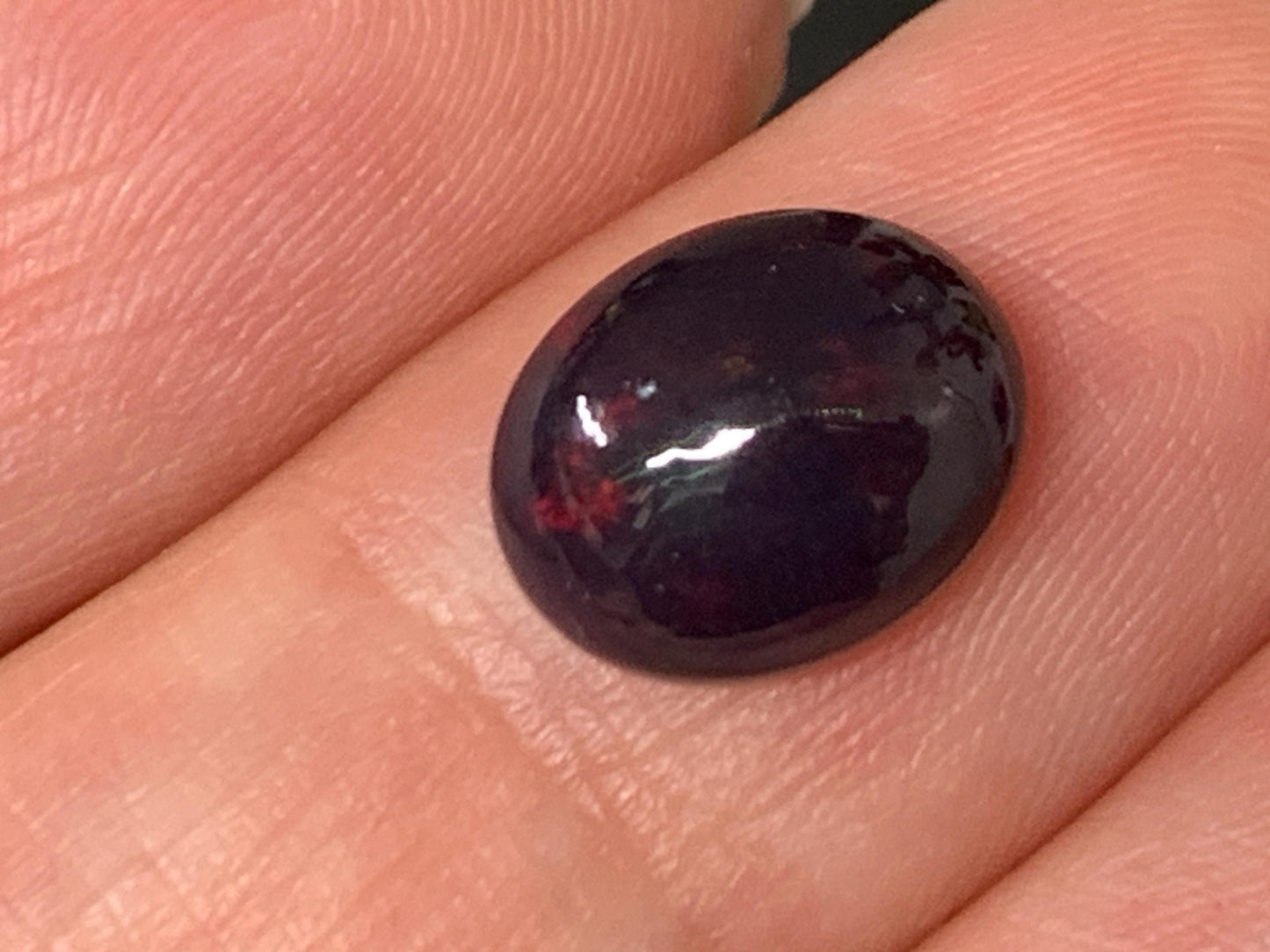 Natural Ethiopian Black Opal 8x10x5mm cabochon