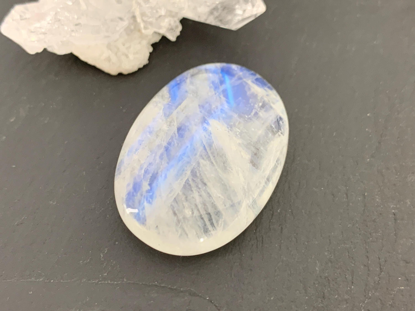 Rainbow Moonstone oval 35x24x9mm cabochon
