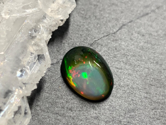 Natural Black Ethiopian Opal oval 8x11x4mm cabochon