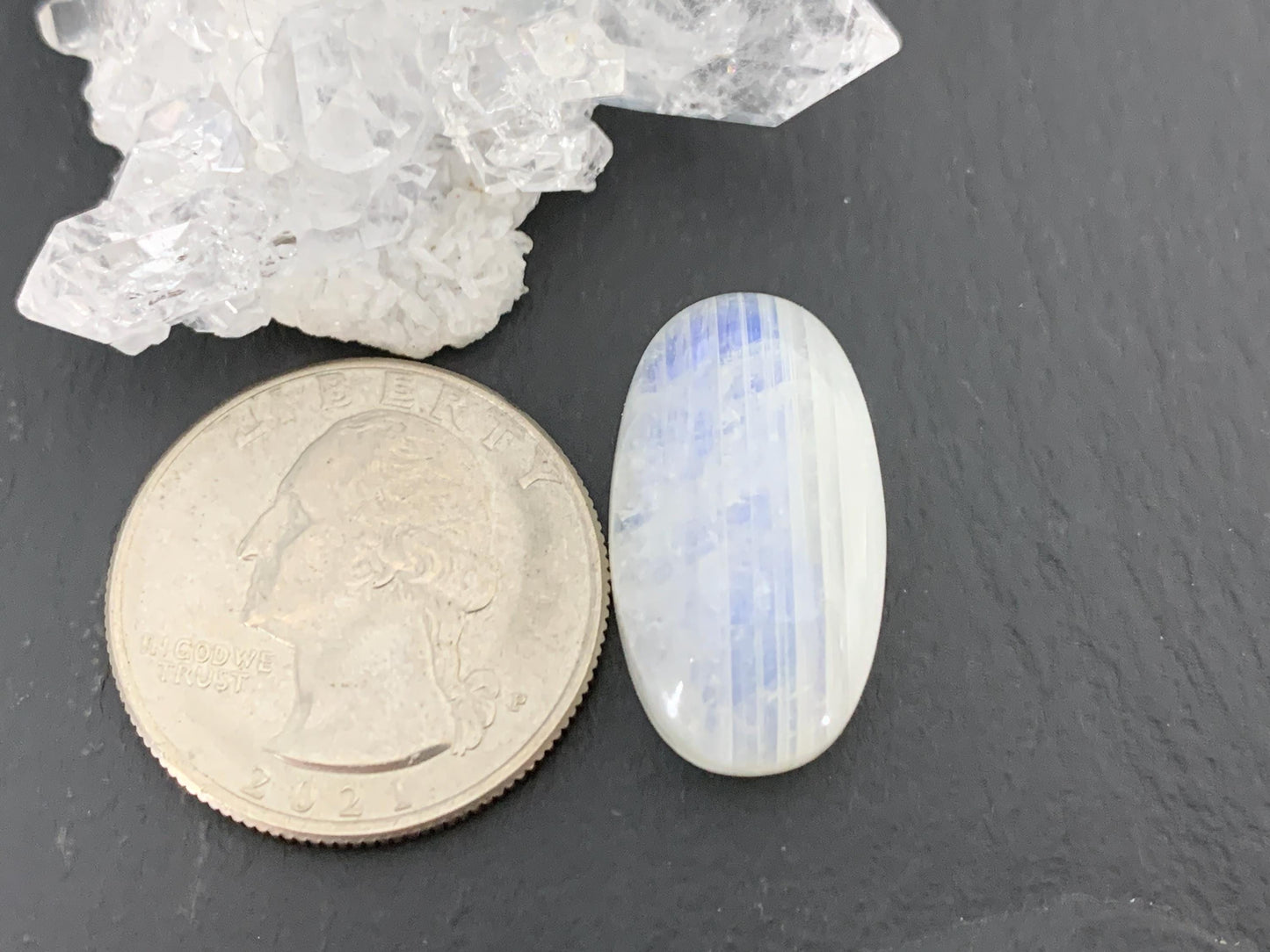 Rainbow Moonstone oval 24x13x8mm cabochon