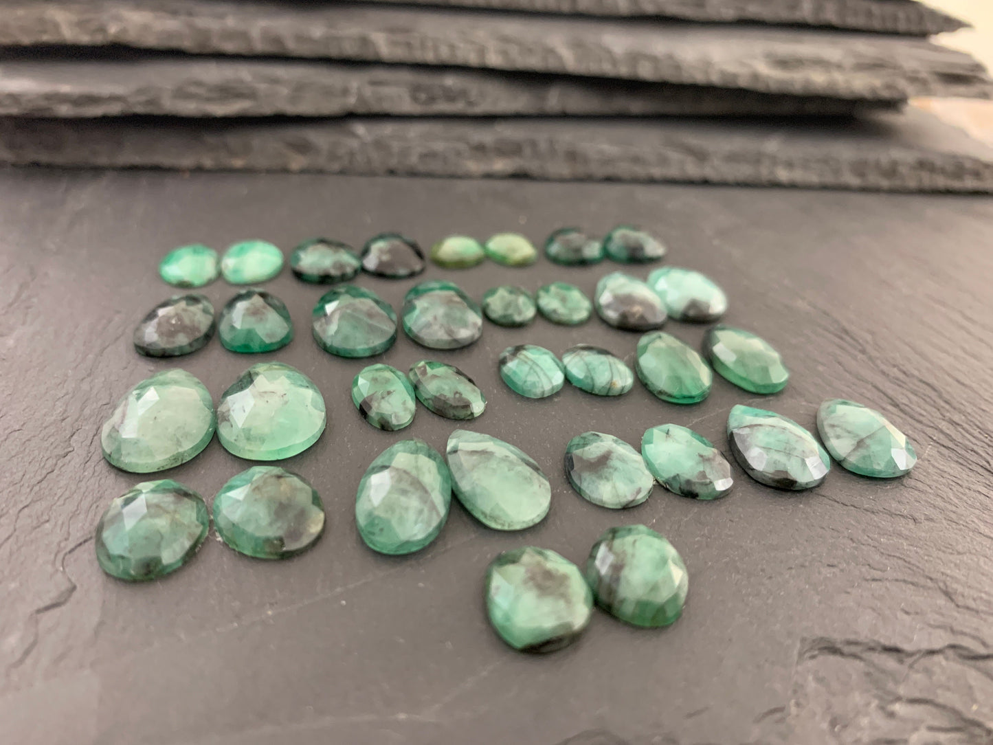 Faceted Emerald pair 9-19mm long cabochon