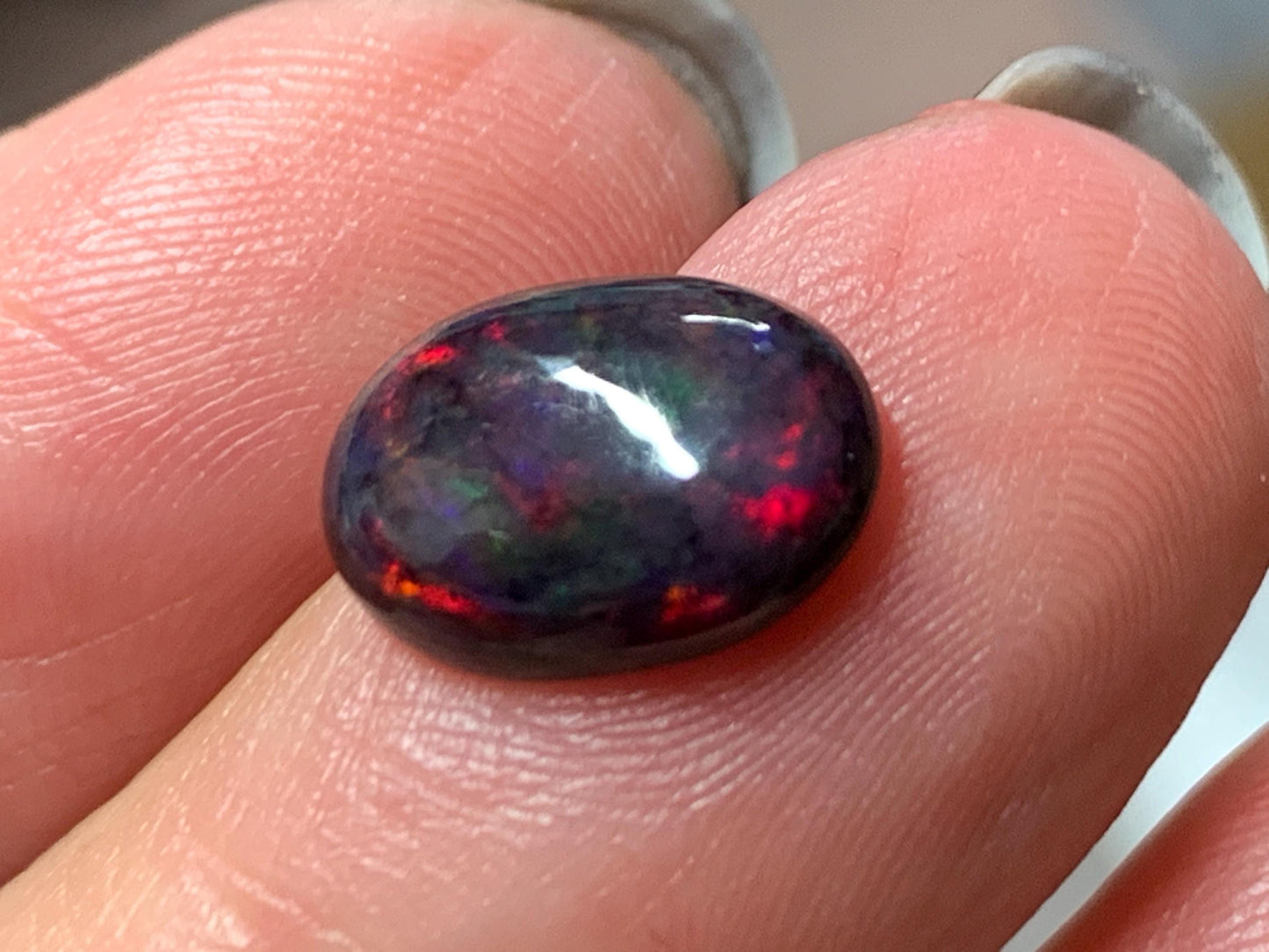 Natural Ethiopian Black Opal 9x11x5mm cabochon