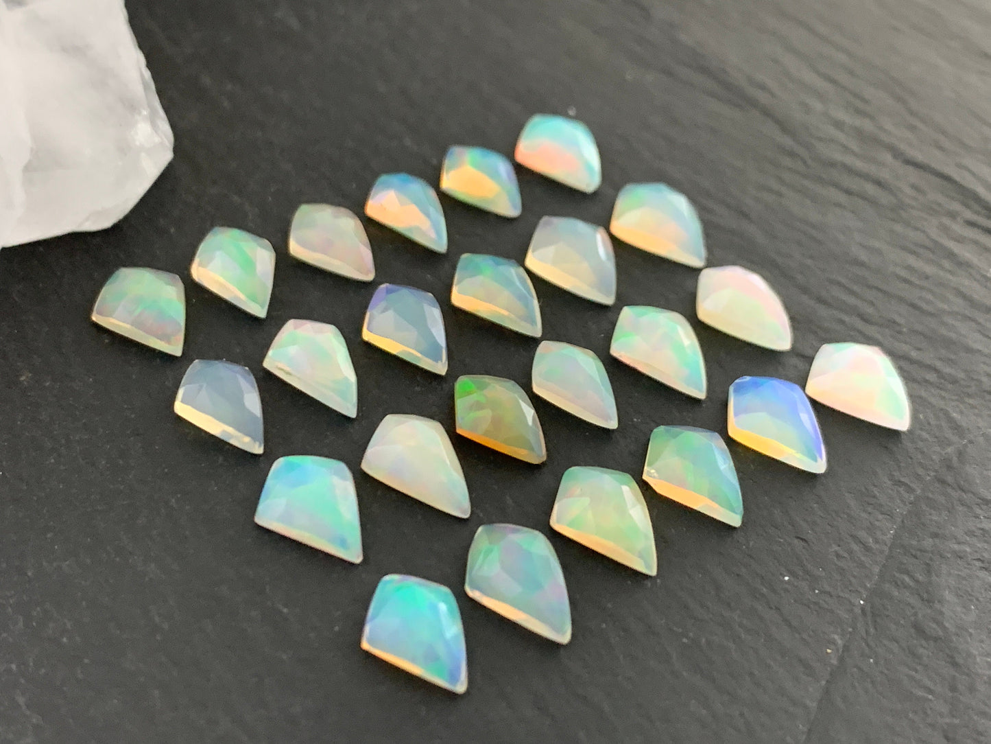 Faceted Welo Opal kite 7x9mm cabochon
