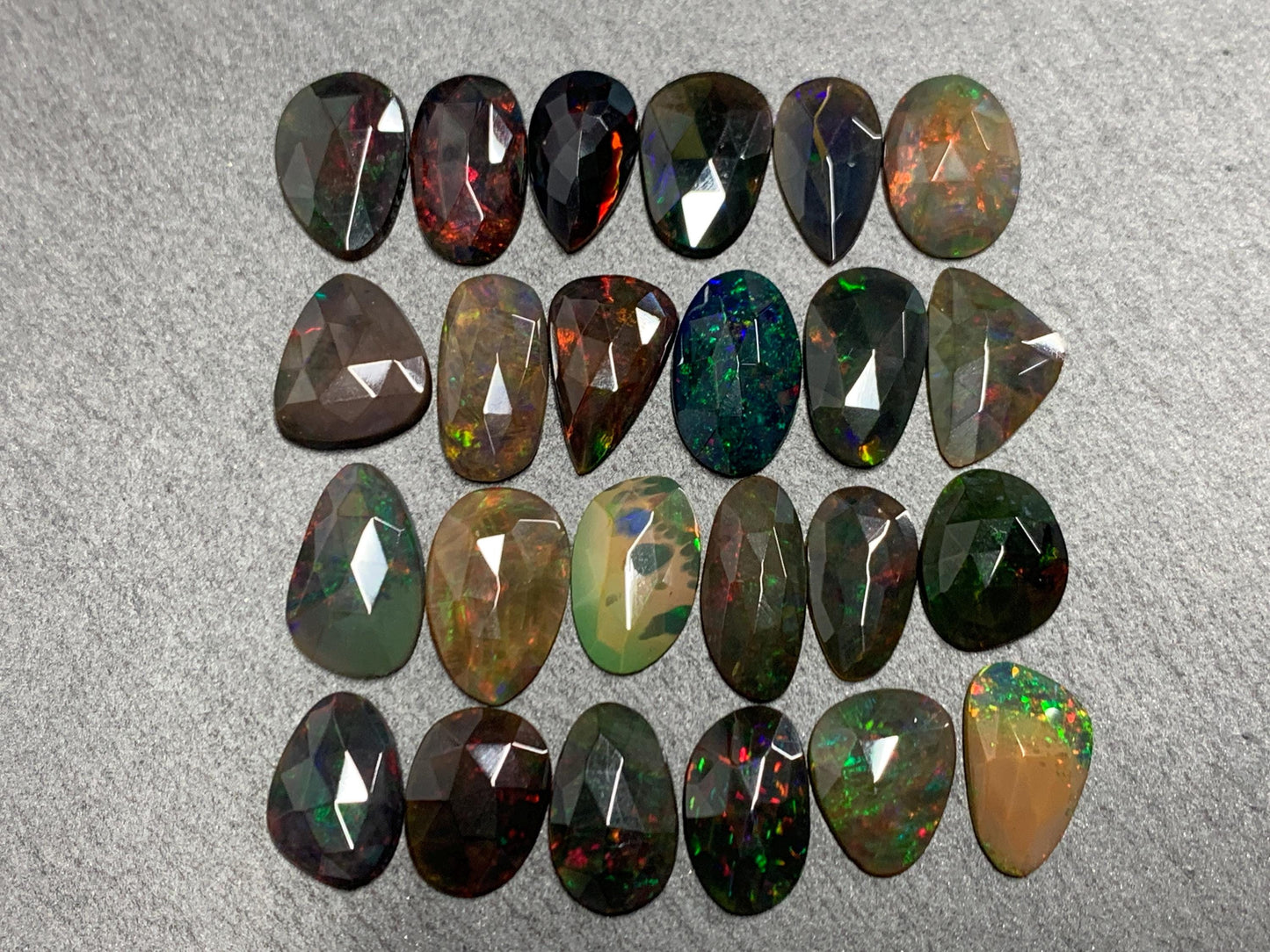 Faceted Black Opal 11-14mm long free form cabochon