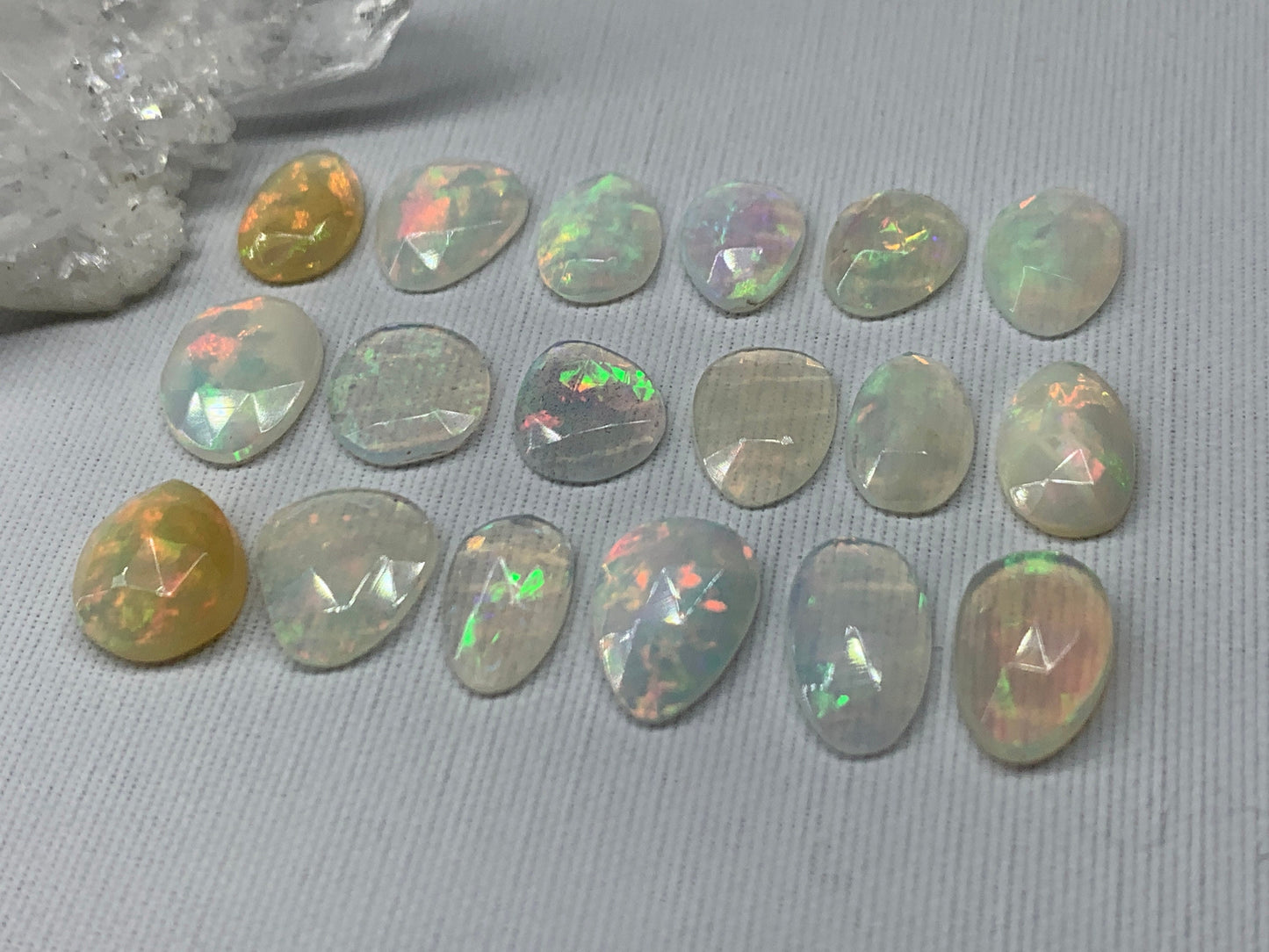 Faceted Ethiopian Opal 10-12mm long cabochon