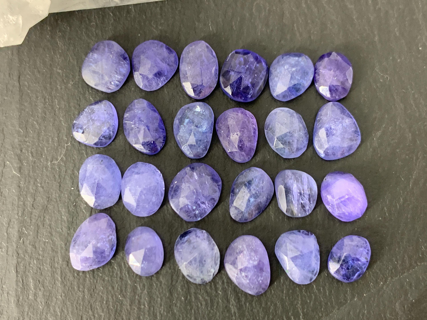 Discounted Damaged Faceted Tanzanite 8-10mm long cabochon