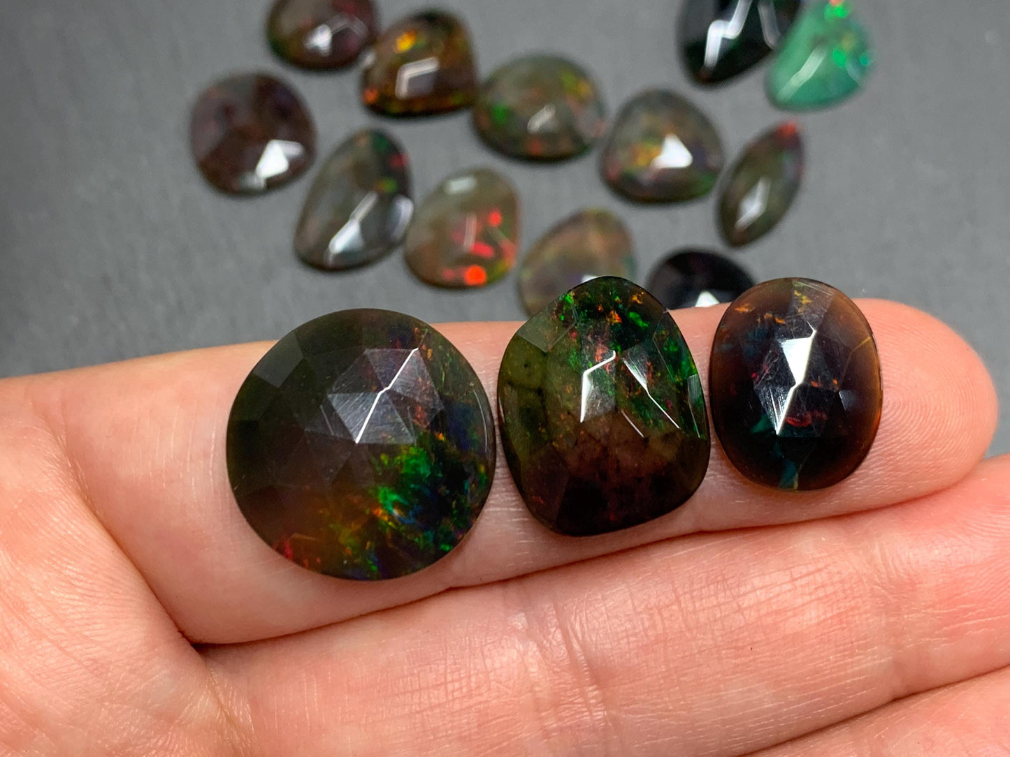 Faceted Black Ethiopian Opal 12-16mm long cabochon