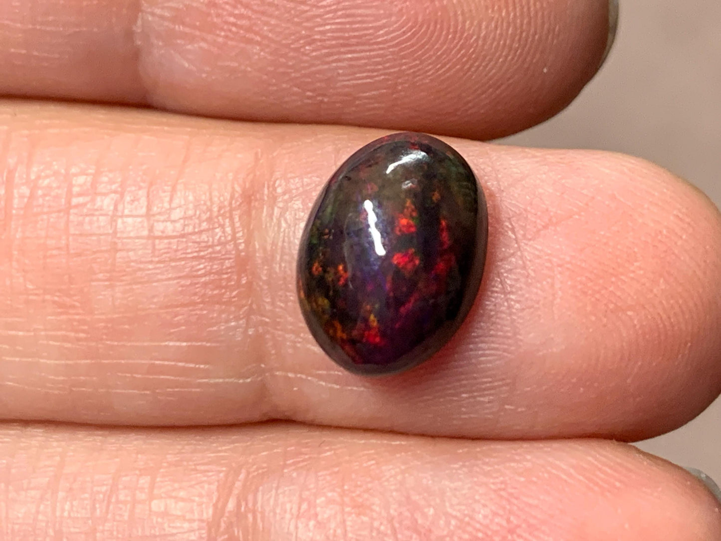 Black Ethiopian Opal oval 8x11x4.5mm cabochon.