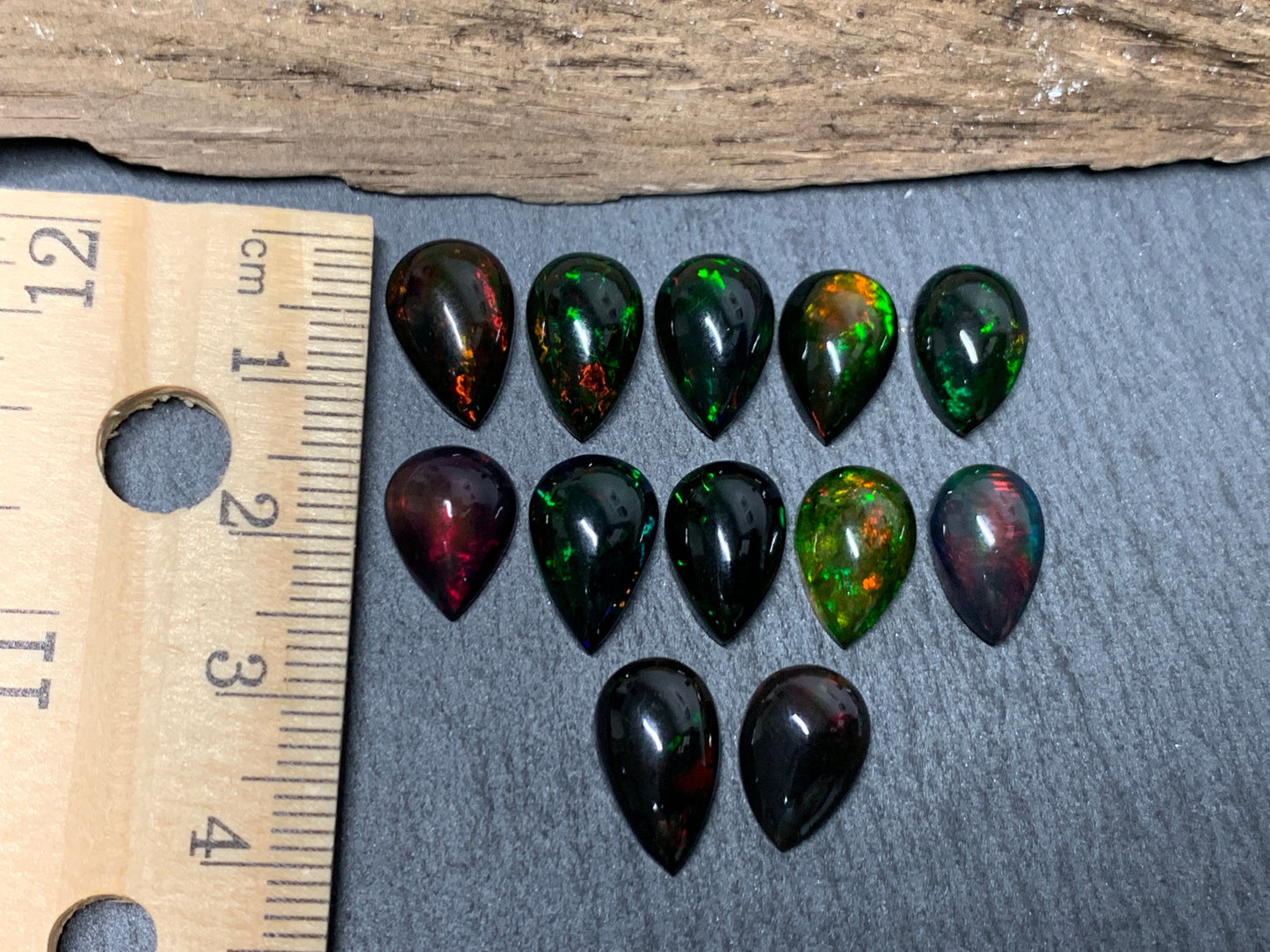 Black Ethiopian Opal pear 12-13mm long cabochon