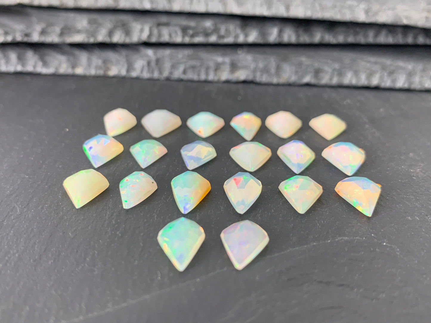 Faceted Ethiopian Opal kite 12-12.5mm long cabochon