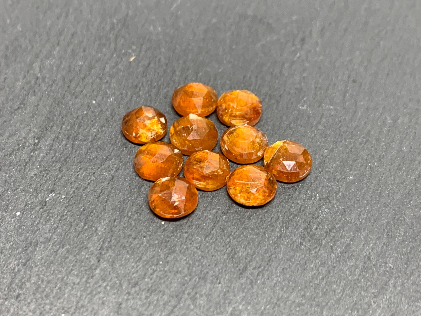 Damaged - faceted orange Kyanite round 7mm cabochons