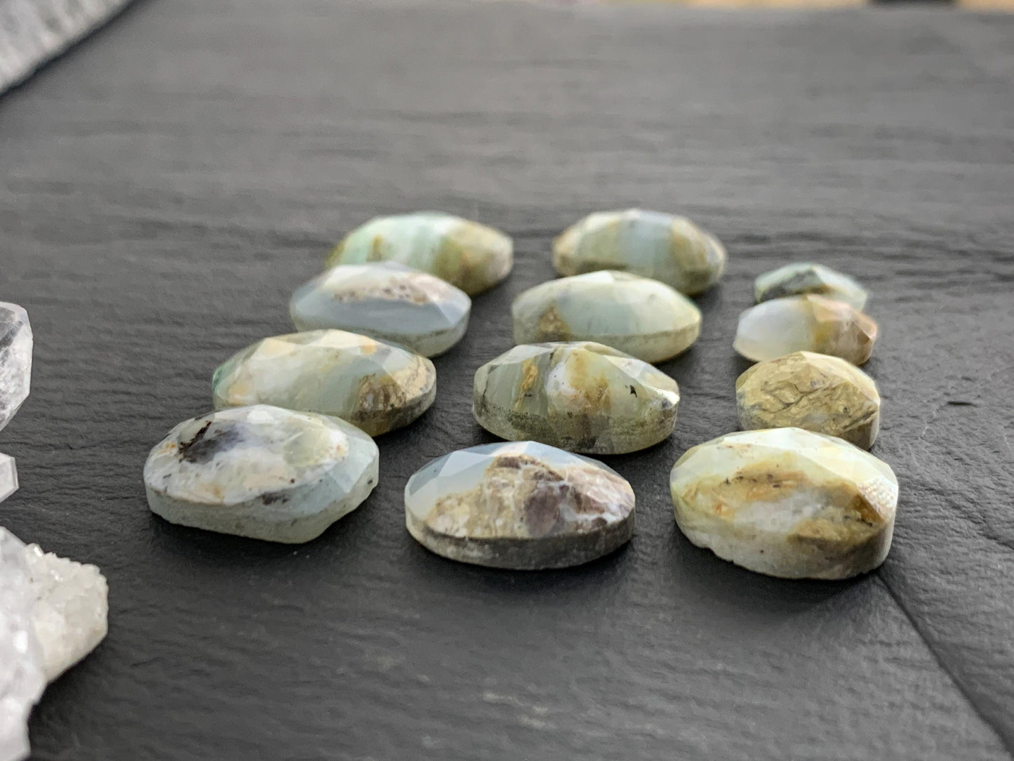 Faceted Peruvian Opal 8-14mm long cabochon.
