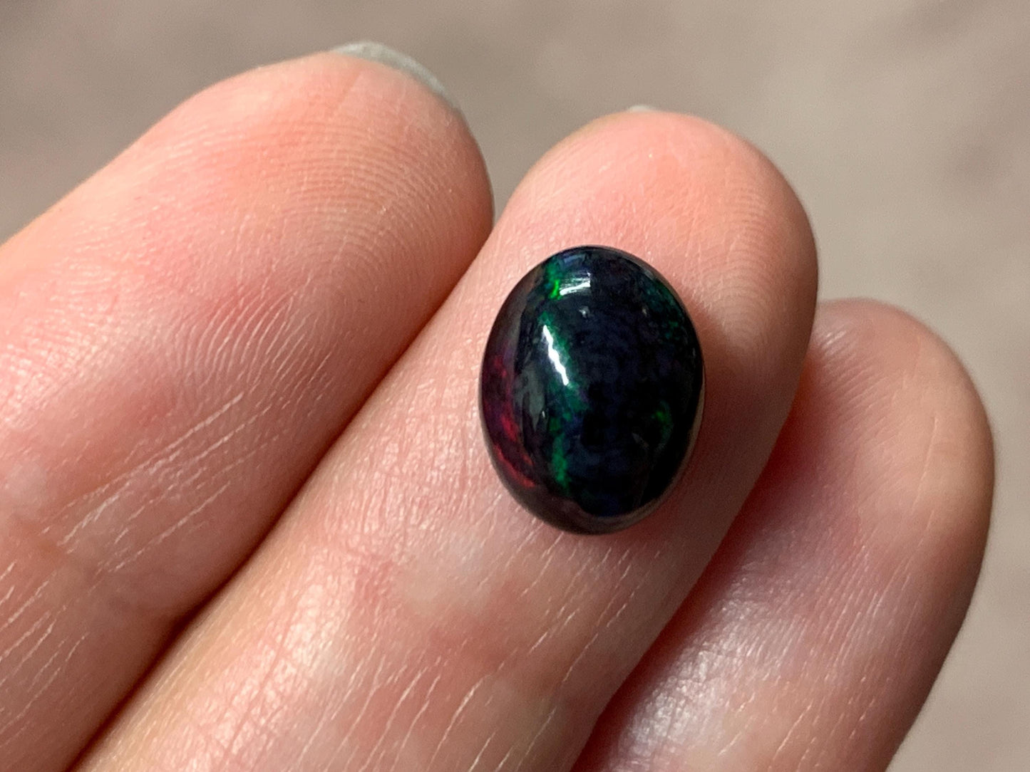 Black Ethiopian Opal oval 8x11x5mm cabochon