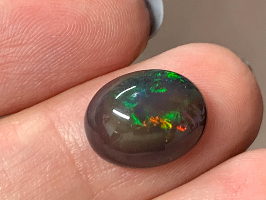 Natural Ethiopian Black Opal 10x13x5mm cabochon