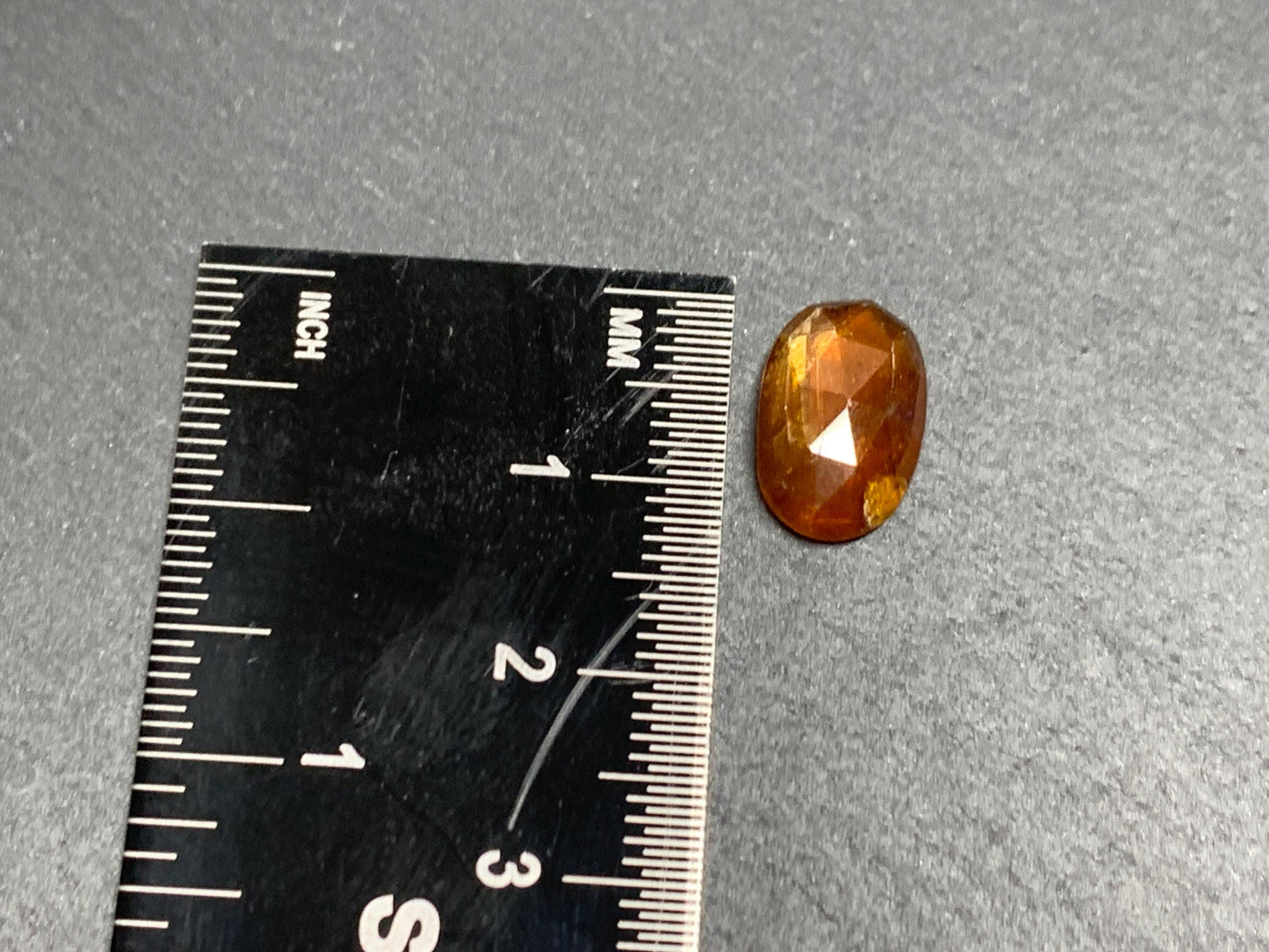 Damaged - faceted orange Kyanite oval 13mm long cabochons