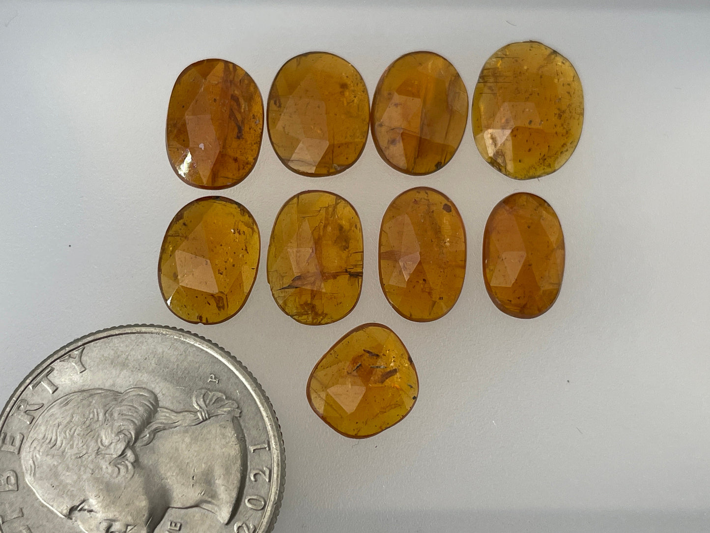 Faceted Orange Kyanite oval 9-12mm long cabochon