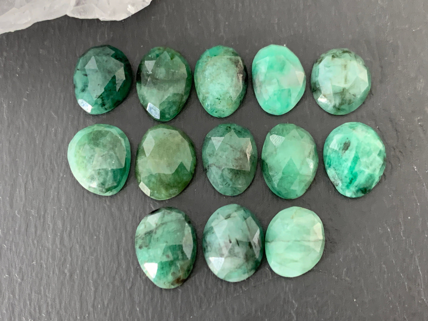 Faceted Emerald oval 12-13mm cabochon