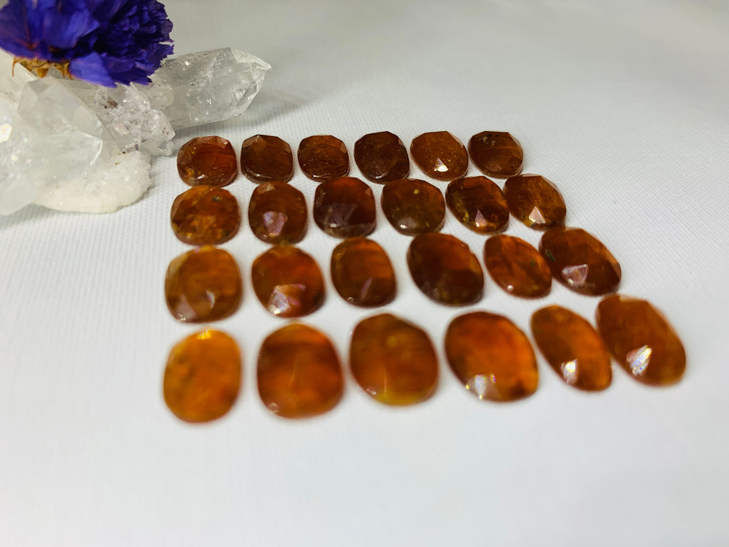 Faceted Orange Kyanite oval 10-11mm cabochon