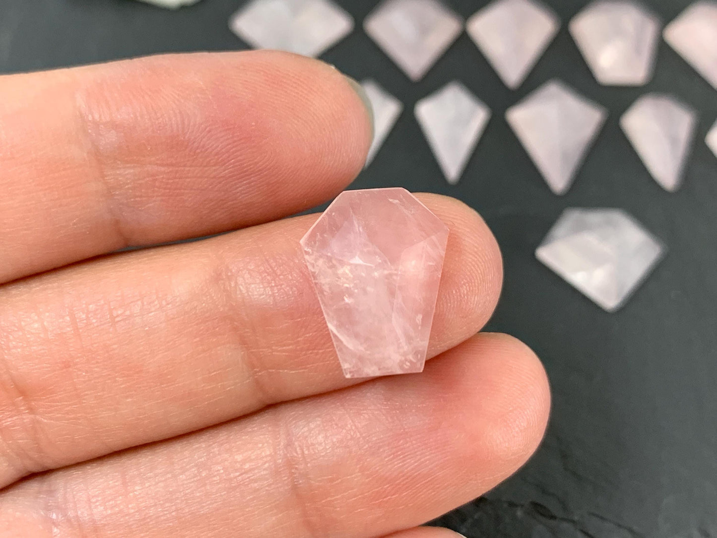 Faceted Rose Quartz step cut cabochon.