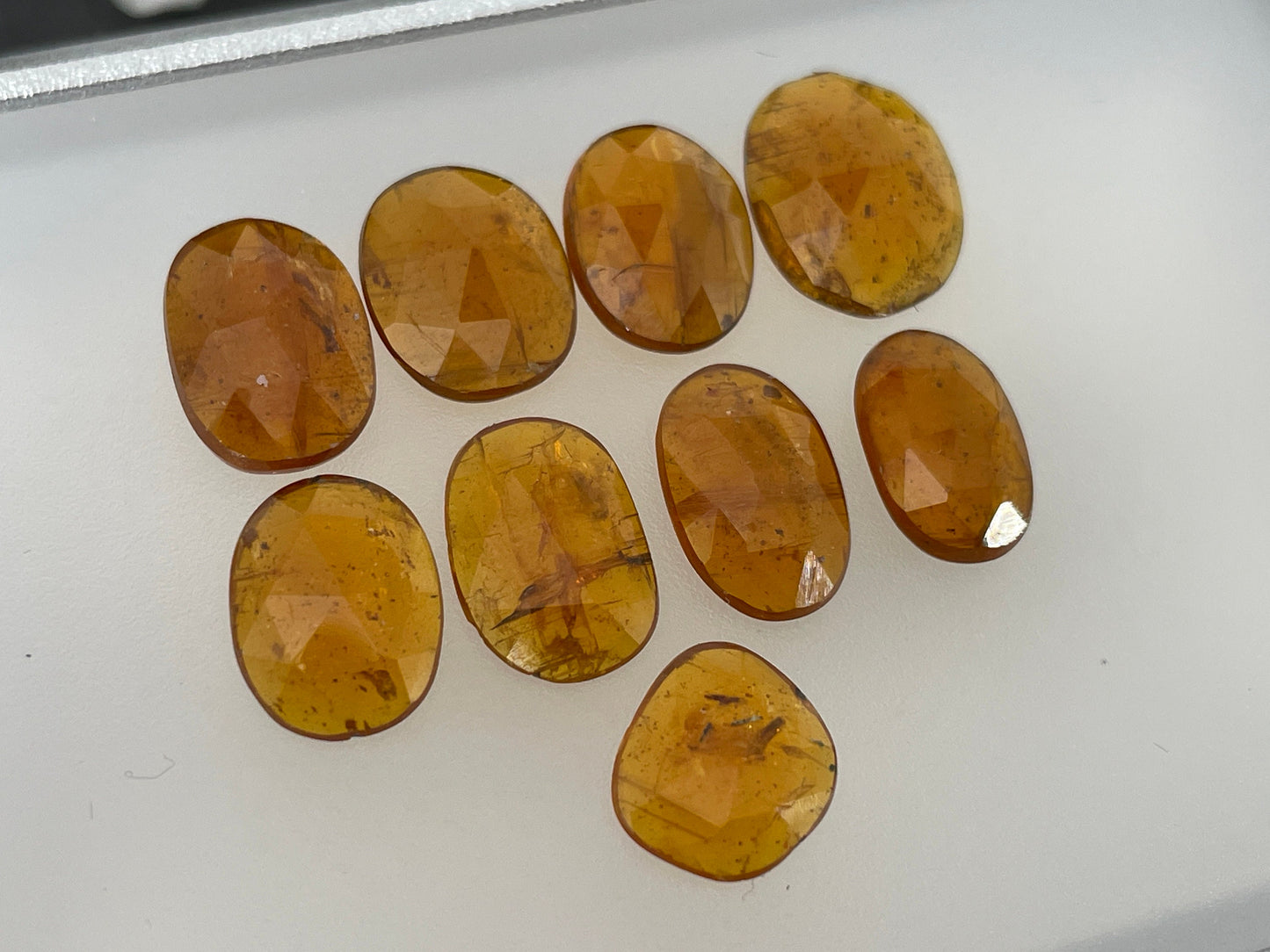 Faceted Orange Kyanite oval 9-12mm long cabochon