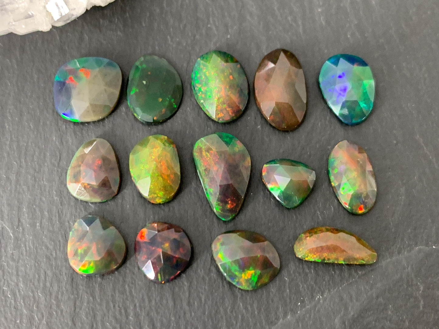 Faceted black Ethiopian Opal 8-12mm long cabochon