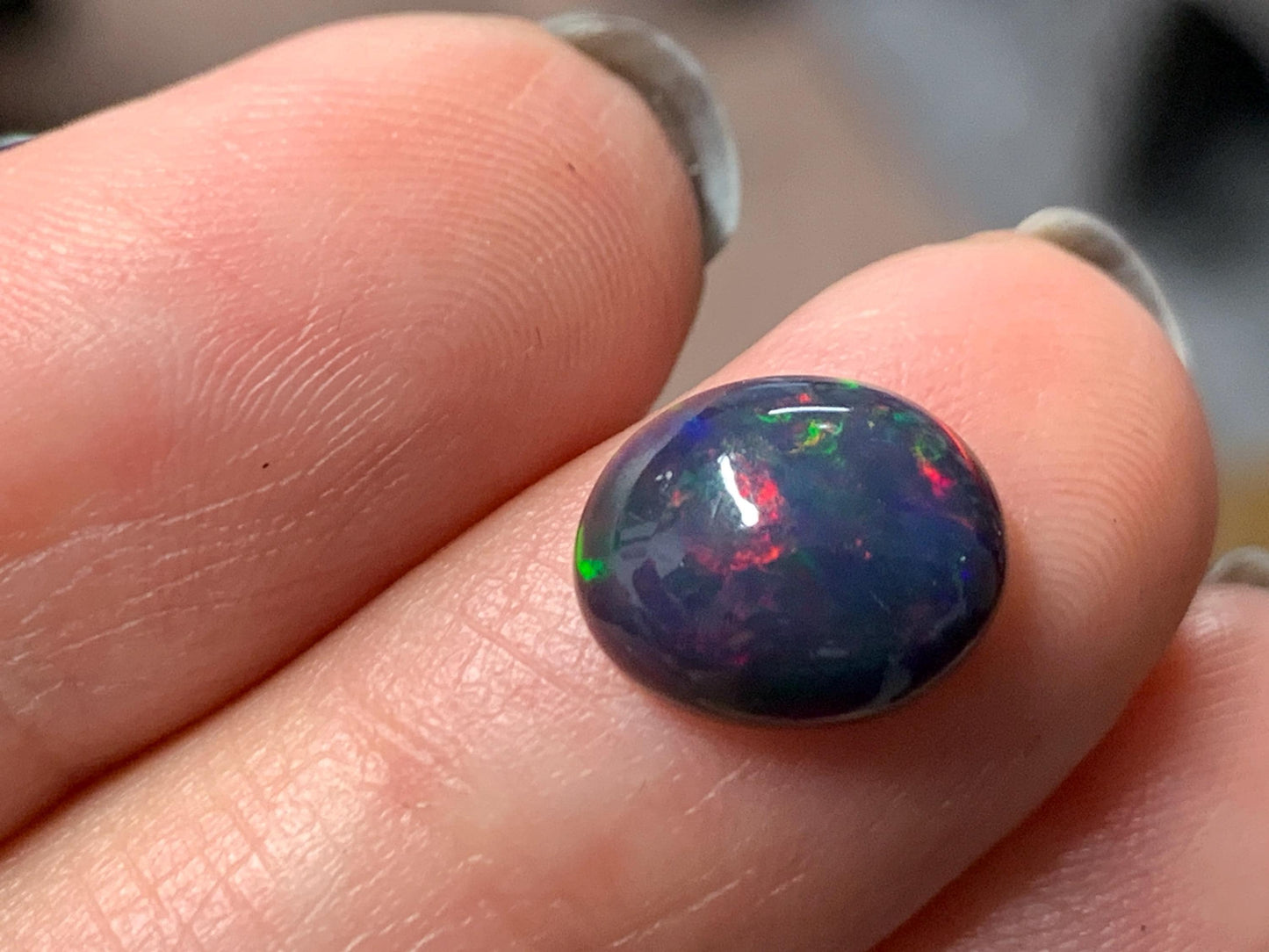 Natural Ethiopian Black Opal 8x11x4mm cabochon