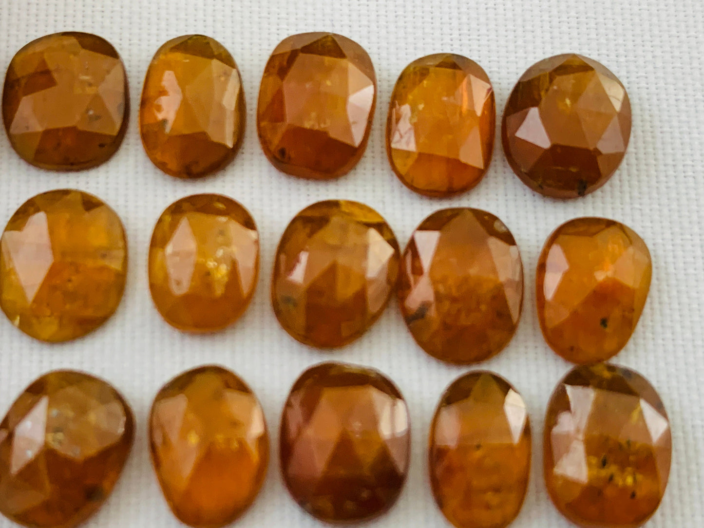 Faceted Orange Kyanite oval 9-10mm long cabochon