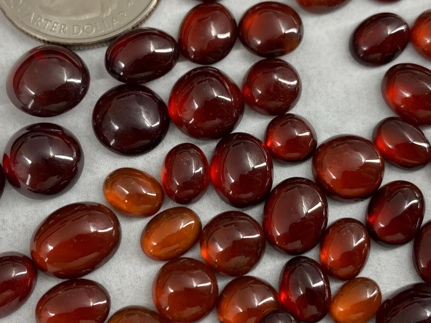 Hessonite Garnet oval, round 7-11mm long cabochon
