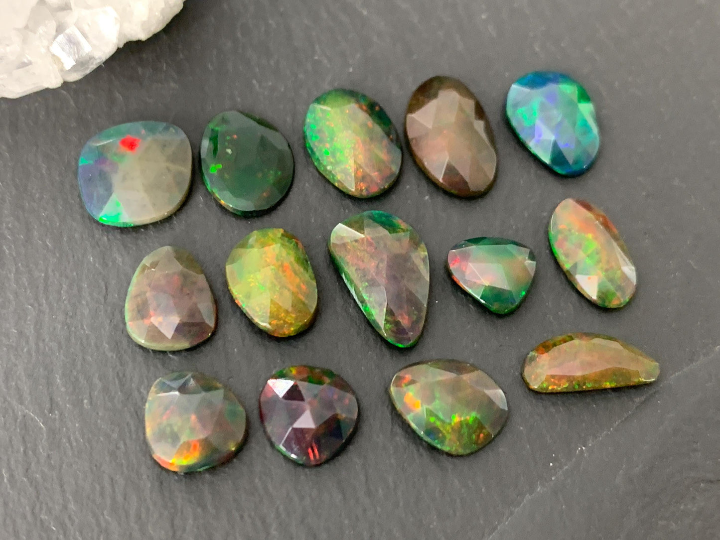Faceted black Ethiopian Opal 8-12mm long cabochon