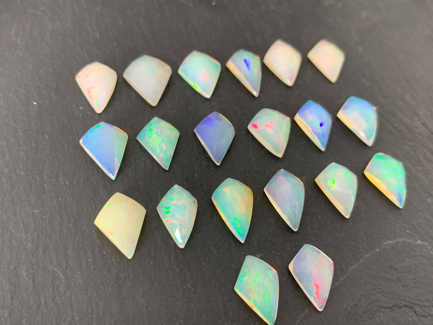 Faceted Ethiopian Opal kite 12-12.5mm long cabochon