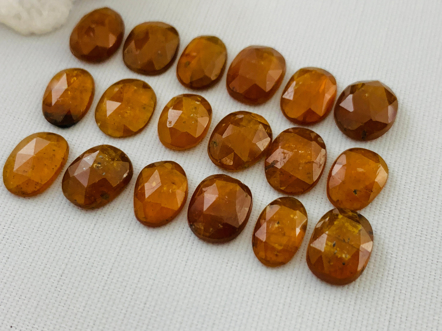 Faceted Orange Kyanite oval 9-10mm long cabochon