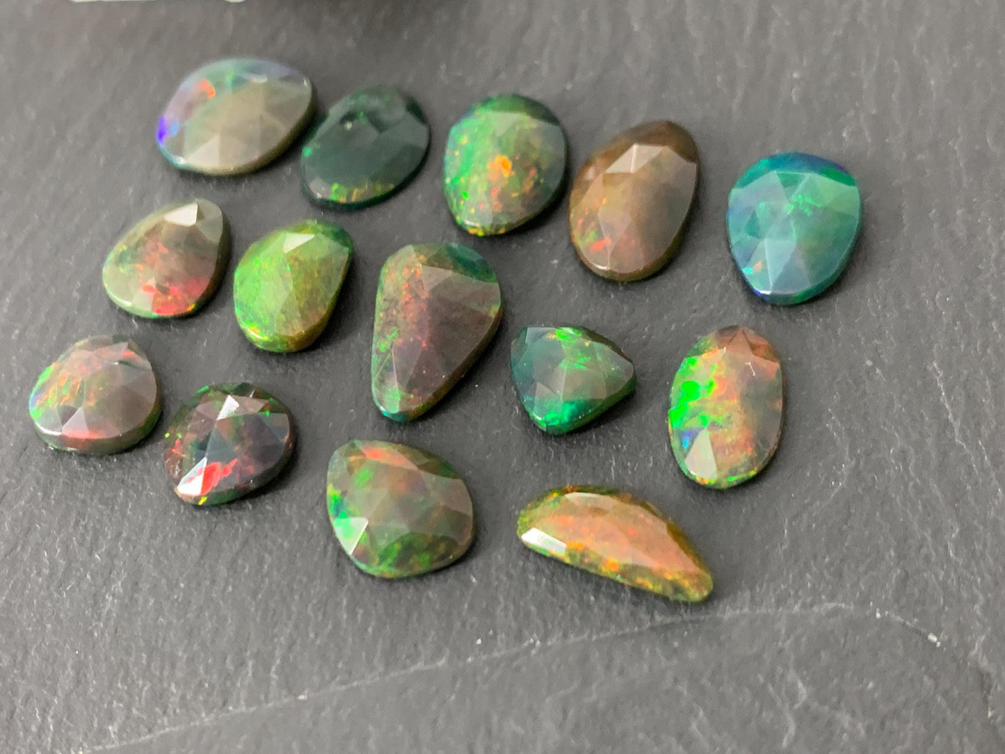 Faceted black Ethiopian Opal 8-12mm long cabochon