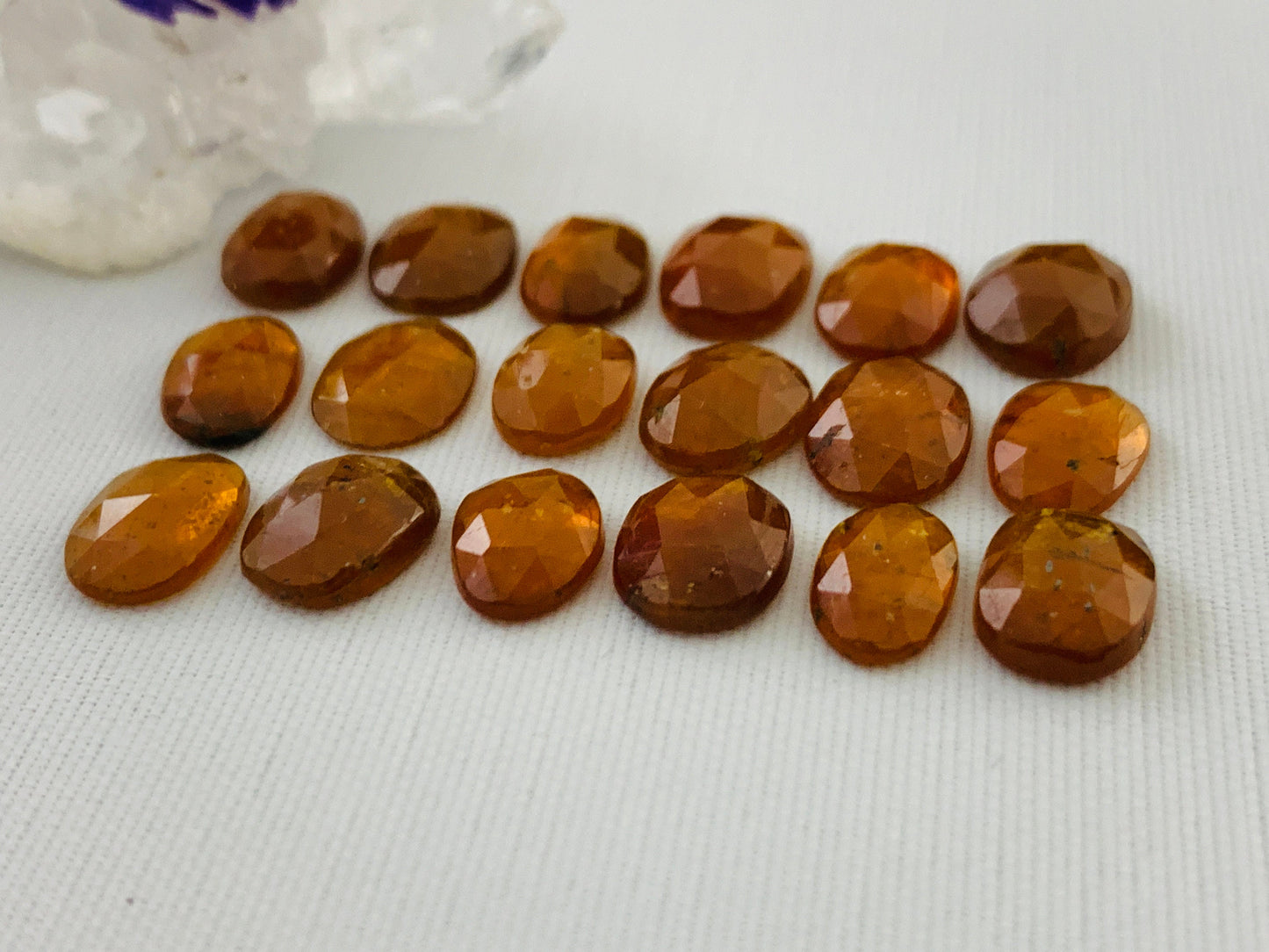 Faceted Orange Kyanite oval 9-10mm long cabochon