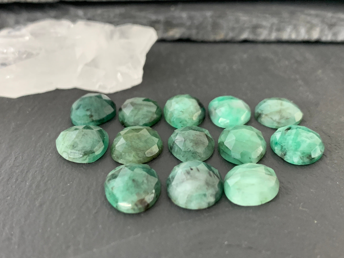 Faceted Emerald oval 12-13mm cabochon