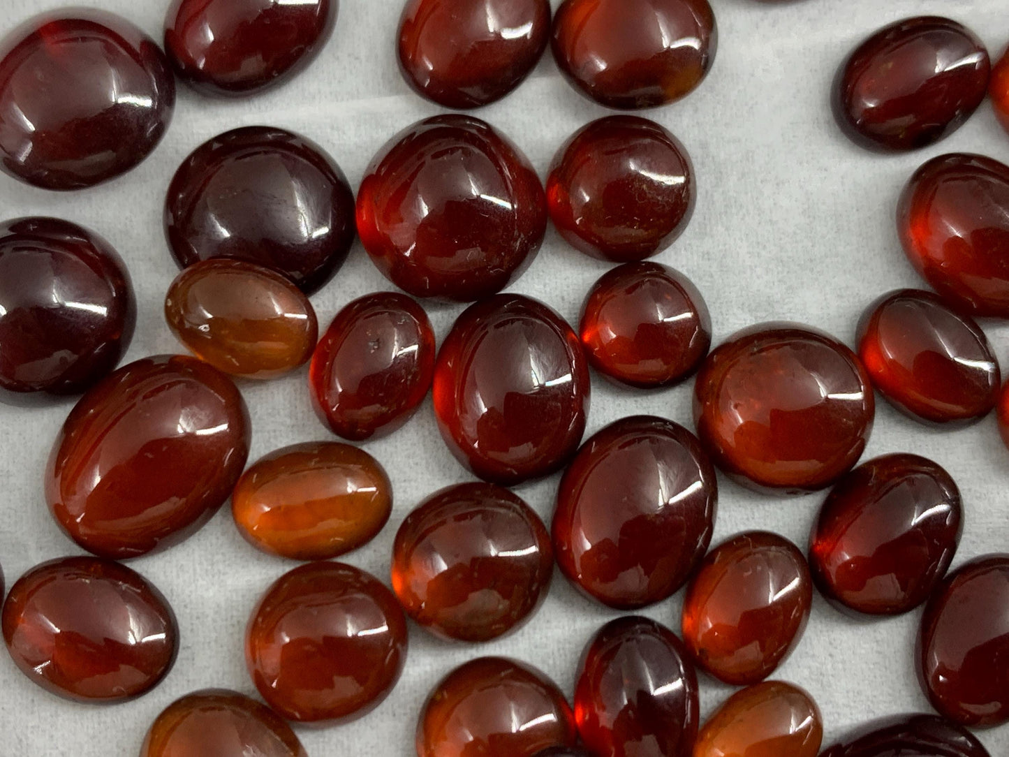 Hessonite Garnet oval, round 7-11mm long cabochon