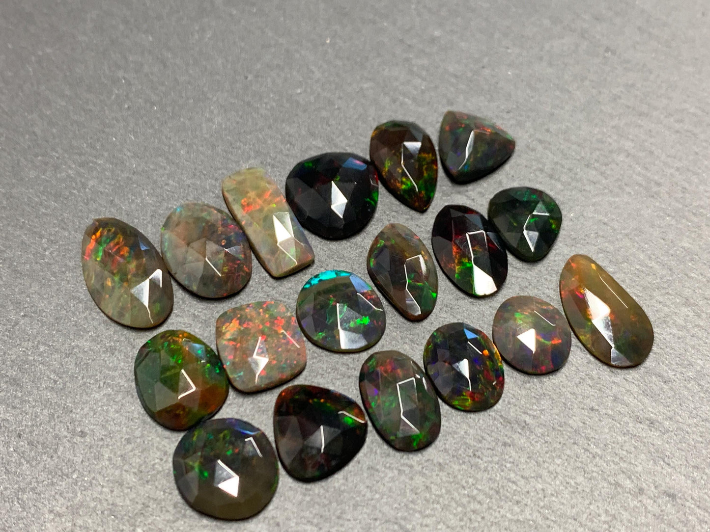 Faceted Black Opal oval 10-16mm long cabochon