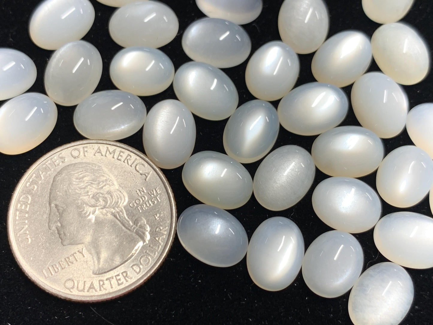 White Moonstone oval 8-11mm long cabochon