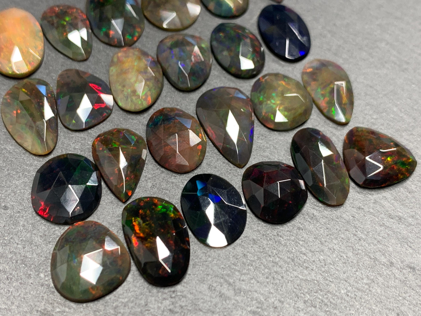 Faceted Black Ethiopian Opal 12-16mm long cabochon