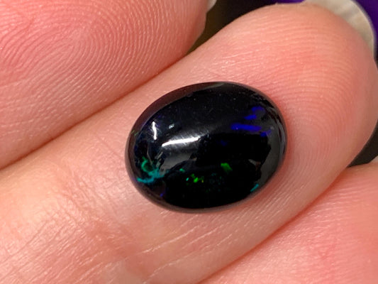 Natural Ethiopian Black Opal 9x11x4mm cabochon