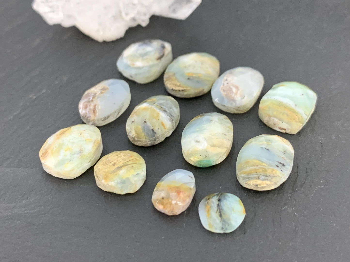 Faceted Peruvian Opal 8-14mm long cabochon.