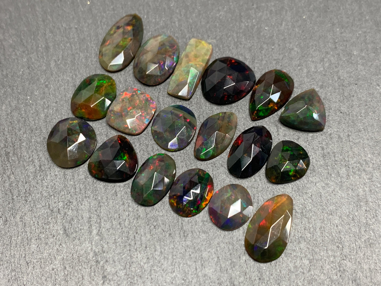 Faceted Black Opal oval 10-16mm long cabochon