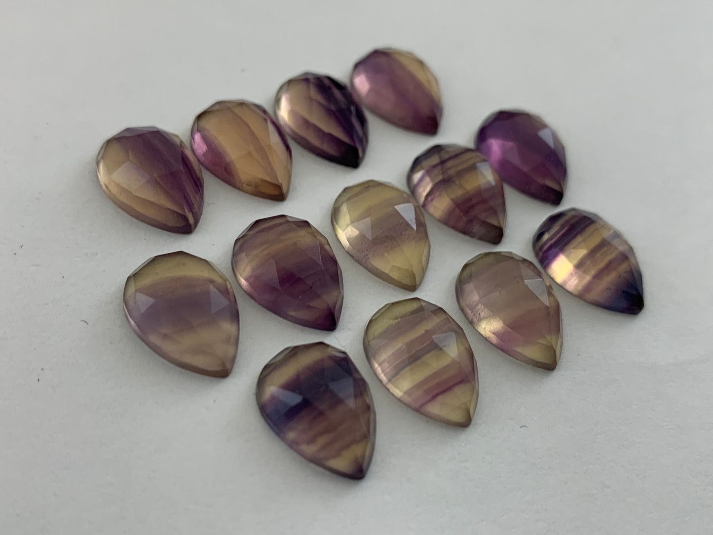 Faceted Fluorite pear 10x13mm cabochon