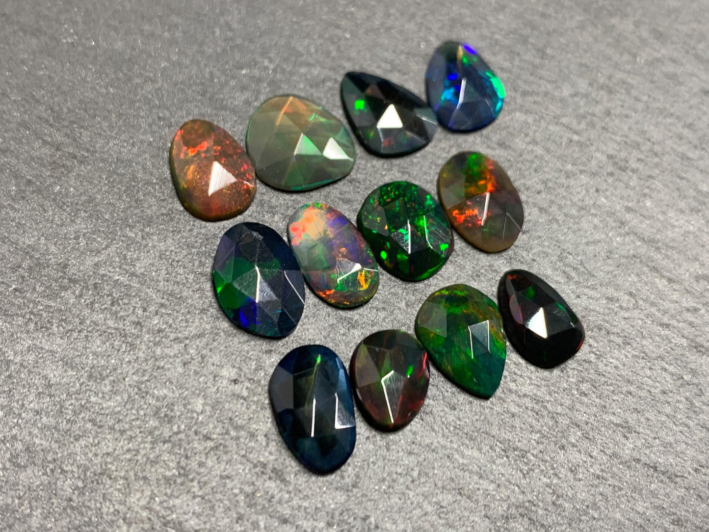 Faceted Black Opal free form 7-9mm long cabochon