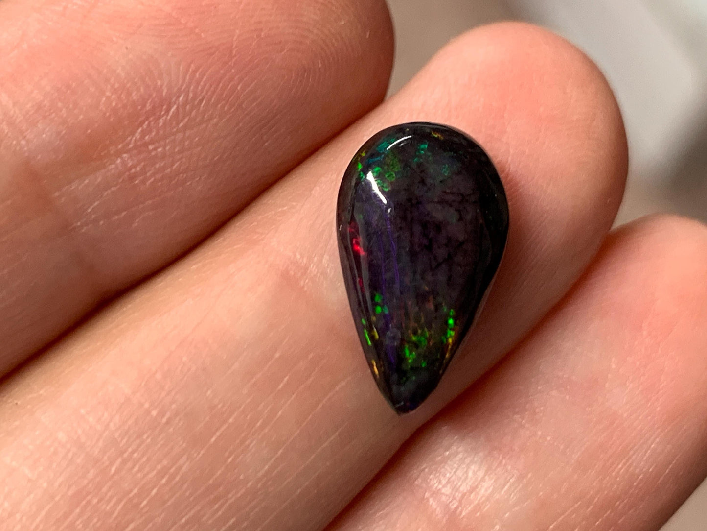 Black Ethiopian Opal pear 9x14x3mm cabochon